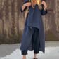 Ensemble deux pièces composé d'un haut et d'un pantalon avec un ourlet haut-bas de couleur unie