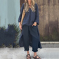 Ensemble deux pièces composé d'un haut et d'un pantalon avec un ourlet haut-bas de couleur unie