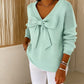 Maglione con fiocco con scollo a V da donna