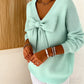 Maglione con fiocco con scollo a V da donna